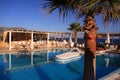 Swimming pool, palm tree luxury resort Royalty Free Stock Photo