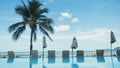 Swimming pool with palm tree near the sea on Koh Samui Royalty Free Stock Photo