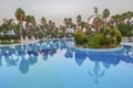 Swimming pool, palm trees, park recreation area Royalty Free Stock Photo