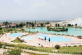 Swimming pool and Pamukkale town in Turkey Royalty Free Stock Photo