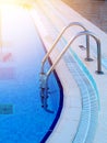Swimming pool in-pool ladder and depth marker, Royalty Free Stock Photo