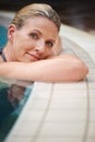 Swimming pool, portrait and woman relax on holiday, summer vacation and weekend getaway. Travel, luxury spa resort and Royalty Free Stock Photo