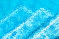 Swimming pool ripples caused by rain above steps. Royalty Free Stock Photo