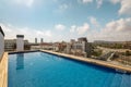 Swimming pool on roof top with beautiful city view on sunny day in Barcelona, Spain Royalty Free Stock Photo