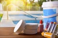 Swimming pool service and chemicals and pool background