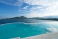 Swimming pool with stair on top of roof deck building looking at view tropical sea ,Luxury beach villa house with sea view Royalty Free Stock Photo