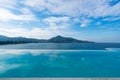 Swimming pool with stair on top of roof deck building looking at view tropical sea ,Luxury beach villa house with sea view Royalty Free Stock Photo