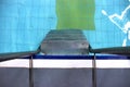 Swimming pool with stair. water and tiles below. first-person view