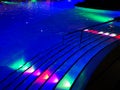 Swimming pool staircase colorful illuminated night