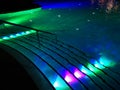 Swimming pool staircase colorful illuminated night