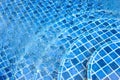 Swimming pool with stairs in blue water Royalty Free Stock Photo