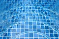 Swimming pool with stairs in blue water. Royalty Free Stock Photo