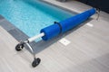 Swimming pool steel blue bubble solar winder detail for protection and heat the water Royalty Free Stock Photo