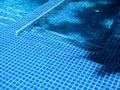 Swimming pool steps with clear water surface background, nobody. Abstract pool texture, underwater pattern blue background. Royalty Free Stock Photo