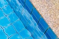 Swimming pool with a stone flooring beside it detail Royalty Free Stock Photo