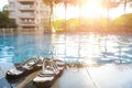 Swimming pool in sunny morning with sunflare horizontal composition Royalty Free Stock Photo
