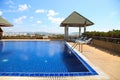 Swimming pool with sunny reflections on good weather day. Relax time with family on swimming pool. Popular sport