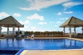 Swimming pool with sunny reflections on good weather day. Relax time with family on swimming pool. Popular sport