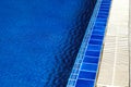 Swimming pool with sunny reflections on good weather day. Relax time with family on swimming pool. Popular sport Royalty Free Stock Photo