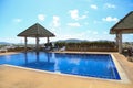 Swimming pool with sunny reflections on good weather day. Relax time with family on swimming pool. Popular sport Royalty Free Stock Photo