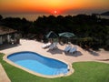 Swimming pool and sunset Royalty Free Stock Photo