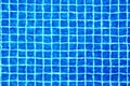 Swimming pool surface texture close up top view, blue water background, caustics ripple, swimming pool tiled bottom backdrop, sea Royalty Free Stock Photo