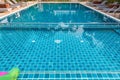 Swimming Pool.swimming pool bottom caustics ripple and flow with waves background.Swimming pool of luxury hotel