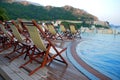 Swimming pool, terrace and outdoor chairs Royalty Free Stock Photo