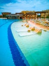 Swimming pool, territory with palms and sea view in Egyptian hotel Royalty Free Stock Photo