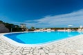 Swimming pool with tiled border and turquois water