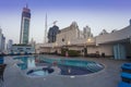 swimming pool on top of building, sunset scene in Dubai, United Arab Emirates