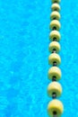 Swimming pool with transparent water, with yellow indicator float line.