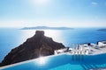 Swimming pool with a view on Caldera over Aegean sea, Santorini, Greece Royalty Free Stock Photo