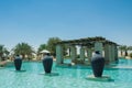 Swimming pool view with three jugs at the desert arabian resort