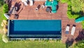 Swimming Pool viewed from above. Top down view of modern luxury villa with swimming pool. Aerial luxury resort landscape Royalty Free Stock Photo