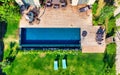 Swimming Pool viewed from above. Top down view of modern luxury villa with swimming pool. Aerial luxury resort landscape Royalty Free Stock Photo