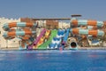 Swimming pool with water slides in a luxury tropical hotel resort Royalty Free Stock Photo