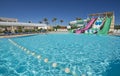 Swimming pool with water slides in a luxury tropical hotel resort Royalty Free Stock Photo