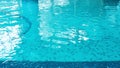 Swimming pool water surface with blue mosaic tiles. Beautiful background with texture of pool water with copy space. Nobody is in Royalty Free Stock Photo
