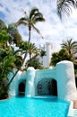 Swimming pool with waterfall and building of luxury hotel Royalty Free Stock Photo