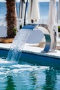 Swimming pool waterfall jet Royalty Free Stock Photo