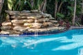 Swimming Pool and Waterfall Royalty Free Stock Photo