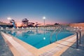 Swimming Pool with waterside during twilight