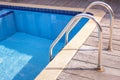 Swimming pool with wooden deck Royalty Free Stock Photo