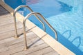 Swimming pool with wooden deck Royalty Free Stock Photo