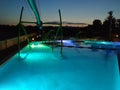 Swimming pools illuminated at night in a tourist complex on the Mediterranean coast Royalty Free Stock Photo