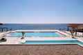 Swimming pools of luxury holiday hotel, amazing nature view landscape sea. Relax near two swimming pools with handrail. Royalty Free Stock Photo