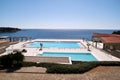 Swimming pools of luxury holiday hotel, amazing nature view landscape sea. Relax near two swimming pools with handrail. Royalty Free Stock Photo