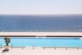 Swimming pools of luxury holiday hotel, amazing nature view landscape sea. Relax near two swimming pools with handrail. Royalty Free Stock Photo