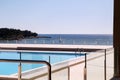 Swimming pools of luxury holiday hotel, amazing nature view landscape sea. Relax near two swimming pools with handrail. Royalty Free Stock Photo